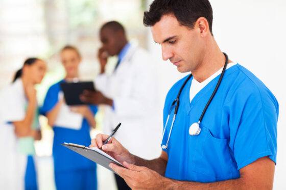 Nurse writing down notes during a home health care in Dekalb County