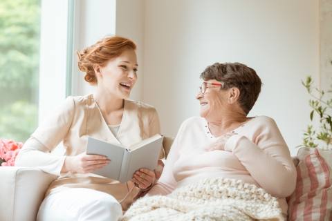 Woman reading during Home Health Services in Alpharetta, Atlanta, Marietta, GA, Douglasville, and Nearby Cities